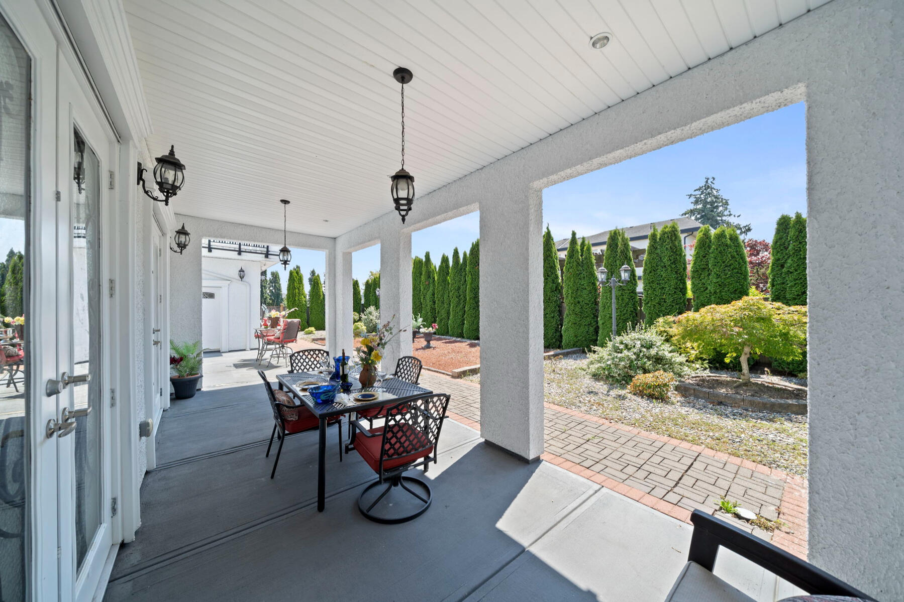 And when the doors open, the living space keeps going. French doors extend the home onto a generous covered patio and south-facing backyard—creating space for outdoor dining, entertaining, or simply slowing down at the end of the day.