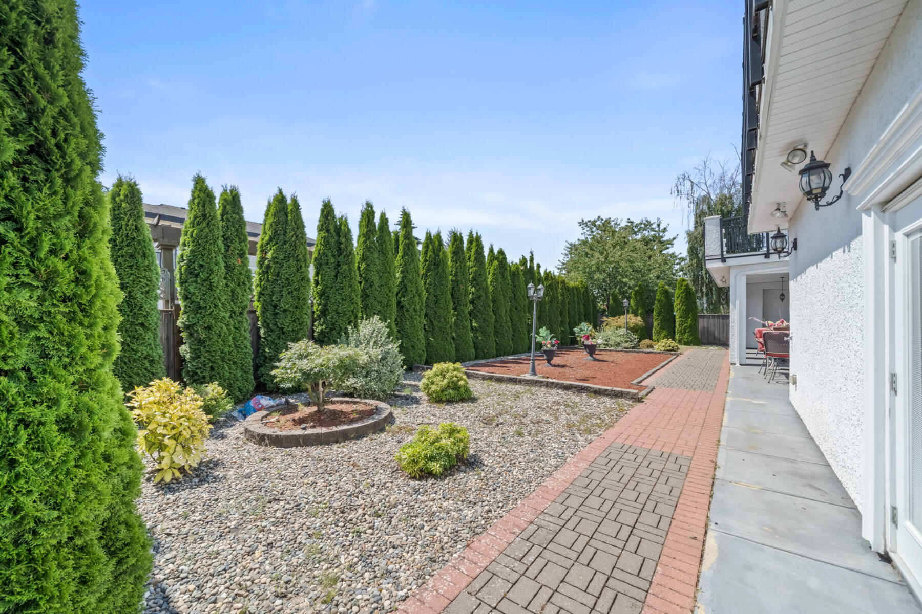 SPACE TO BREATHE. The south-facing backyard offers room to gather, play, garden, or simply enjoy the quiet of your own outdoor space.